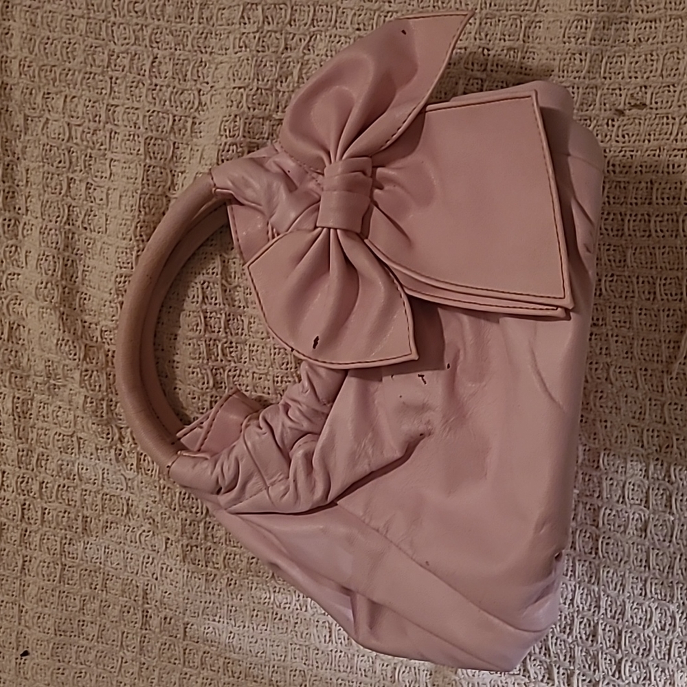 Fashionable light pink back with minimal storage marks, like new